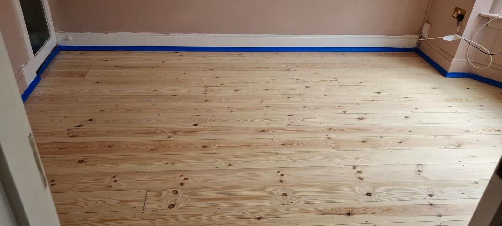 Close-up of expertly refinished floorboards